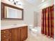 Bathroom featuring decorative framed mirror, vanity, tub, and shower at 27511 Hialeah Way, Wesley Chapel, FL 33544