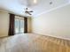 Bedroom with ceiling fan and French doors leading to outdoor area at 27511 Hialeah Way, Wesley Chapel, FL 33544