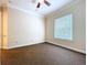 Neutral bedroom features simple décor, window with blinds, ceiling fan, and carpeted floors at 27511 Hialeah Way, Wesley Chapel, FL 33544