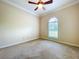Bedroom with a ceiling fan and a sunny window view at 27511 Hialeah Way, Wesley Chapel, FL 33544