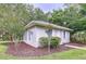 Charming one-story home with beautiful landscaping, arched windows, and well-maintained curb appeal at 27511 Hialeah Way, Wesley Chapel, FL 33544