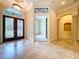 The foyer boasts marble floors, decorative ceilings, and wrought iron accents above the doors at 27511 Hialeah Way, Wesley Chapel, FL 33544