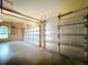 Spacious insulated two-car garage with ample room for vehicles, storage, or hobbies at 27511 Hialeah Way, Wesley Chapel, FL 33544