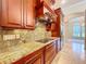 Luxury kitchen with custom cabinets, granite countertops, and stainless appliances at 27511 Hialeah Way, Wesley Chapel, FL 33544