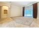Open floor plan with sliding glass doors and access to outdoor living space at 27511 Hialeah Way, Wesley Chapel, FL 33544
