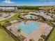 Aerial view of community pool with multiple pools, lounge areas, and lush landscaping at 2771 Suncoast Blend Dr, Odessa, FL 33556