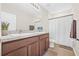 Clean bathroom featuring a double vanity, neutral tiles, and plenty of counter space at 2771 Suncoast Blend Dr, Odessa, FL 33556