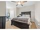 Comfortable bedroom featuring a large bed with neutral linens and a ceiling fan at 2771 Suncoast Blend Dr, Odessa, FL 33556