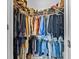 Walk-in closet with plenty of storage racks, rods and shelving for optimal organization at 2771 Suncoast Blend Dr, Odessa, FL 33556