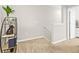 Cozy carpeted hallway with neutral walls, stylish decor, and access to other rooms in the home at 2771 Suncoast Blend Dr, Odessa, FL 33556