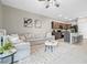 Spacious open-concept living room and kitchen area with comfortable seating and ample natural light at 2771 Suncoast Blend Dr, Odessa, FL 33556