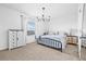 Bright main bedroom with a comfortable bed, decorative dresser, and plenty of natural light from the window at 2771 Suncoast Blend Dr, Odessa, FL 33556