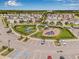 Aerial view of the community playground with blue slides and a covered picnic table at 2771 Suncoast Blend Dr, Odessa, FL 33556