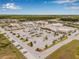 Aerial view of shopping center with Publix, gas station and parking lot filled with vehicles at 2771 Suncoast Blend Dr, Odessa, FL 33556