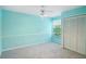 Bright bedroom with a large closet, ceiling fan, and plenty of space for rest and relaxation at 2990 Longbrooke Way, Clearwater, FL 33760