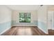 Neutral living room with a large window at 2990 Longbrooke Way, Clearwater, FL 33760