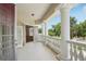 Spacious balcony with white columns and open view at 3062 Sutton Woods Dr, Plant City, FL 33566