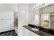 Bathroom with tub, shower, and marble countertops, and a view to the staircase at 3062 Sutton Woods Dr, Plant City, FL 33566