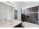 Bathroom with modern vanity and shower-tub combo at 3062 Sutton Woods Dr, Plant City, FL 33566