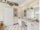 Bathroom featuring a double vanity with marble countertops and tile flooring at 3062 Sutton Woods Dr, Plant City, FL 33566