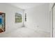 Bright bedroom with large windows and neutral carpet at 3062 Sutton Woods Dr, Plant City, FL 33566