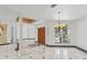 Grand foyer showcasing marble floors, large windows, and a decorative chandelier at 3062 Sutton Woods Dr, Plant City, FL 33566