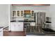 Well-lit kitchen featuring stainless steel appliances and white cabinetry with granite countertops at 3062 Sutton Woods Dr, Plant City, FL 33566