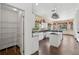 Spacious kitchen with white cabinetry, an island, and walk-in pantry for plenty of storage at 3062 Sutton Woods Dr, Plant City, FL 33566