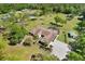 Expansive property with lush greenery, pond, and well-maintained landscaping create a serene and private retreat at 3452 Forelock Rd, Tarpon Springs, FL 34688