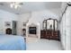 Bedroom with a fireplace, a large dresser and lots of natural light at 3452 Forelock Rd, Tarpon Springs, FL 34688