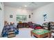 Fun bedroom offering beds and ample play space with a view of the horse farm beyond at 3452 Forelock Rd, Tarpon Springs, FL 34688
