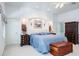 Comfortable bedroom with blue bedding, decorative accents, and recessed lighting at 3452 Forelock Rd, Tarpon Springs, FL 34688