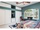 Bedroom featuring ample storage with a large window with plantation shutters and decorative valance at 3452 Forelock Rd, Tarpon Springs, FL 34688