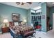 Comfortable bedroom with unique decor and a built-in desk area with ample storage at 3452 Forelock Rd, Tarpon Springs, FL 34688