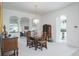 Formal dining area with chandelier, traditional furniture, and open access to other rooms at 3452 Forelock Rd, Tarpon Springs, FL 34688