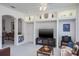 Bright living room featuring recessed lighting, built-in shelving and entertainment center at 3452 Forelock Rd, Tarpon Springs, FL 34688