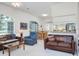 Comfortable living space with an open layout and a view to the dining area and kitchen at 3452 Forelock Rd, Tarpon Springs, FL 34688