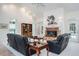 Bright living room with vaulted ceilings, fireplace, and access to the pool area at 3452 Forelock Rd, Tarpon Springs, FL 34688