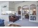 Open living room with view of the dining area and kitchen, and neutral-toned decor at 3452 Forelock Rd, Tarpon Springs, FL 34688