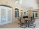 Covered patio with seating and a dining area, perfect for outdoor gatherings at 3452 Forelock Rd, Tarpon Springs, FL 34688