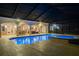 Inviting pool and spa with a screened enclosure, enhancing privacy and outdoor enjoyment in a serene setting at 3452 Forelock Rd, Tarpon Springs, FL 34688