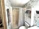 Functional bathroom with a shower and linen storage at 3910 Sarah Dr, Wesley Chapel, FL 33543