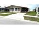 Charming single-story home with covered parking and well-maintained front lawn at 3910 Sarah Dr, Wesley Chapel, FL 33543