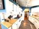 Well-equipped kitchen featuring white appliances and cabinets, complemented by butcher block countertops at 3910 Sarah Dr, Wesley Chapel, FL 33543