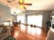 Open-concept living space with hardwood floors and large windows at 3910 Sarah Dr, Wesley Chapel, FL 33543