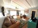 Cozy living room with hardwood floors, ceiling fan, and natural light at 3910 Sarah Dr, Wesley Chapel, FL 33543