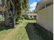 Large backyard with lush greenery, featuring a shed and peaceful surroundings at 503 Sunset Rd, Plant City, FL 33563