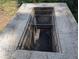 Outdoor barbeque pit with brick sides and metal grate, ready for summer entertaining at 503 Sunset Rd, Plant City, FL 33563