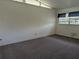 Spacious bedroom featuring a chic white brick wall and neutral carpet at 503 Sunset Rd, Plant City, FL 33563