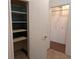 Spacious closet with open shelving and additional storage behind a solid door at 503 Sunset Rd, Plant City, FL 33563